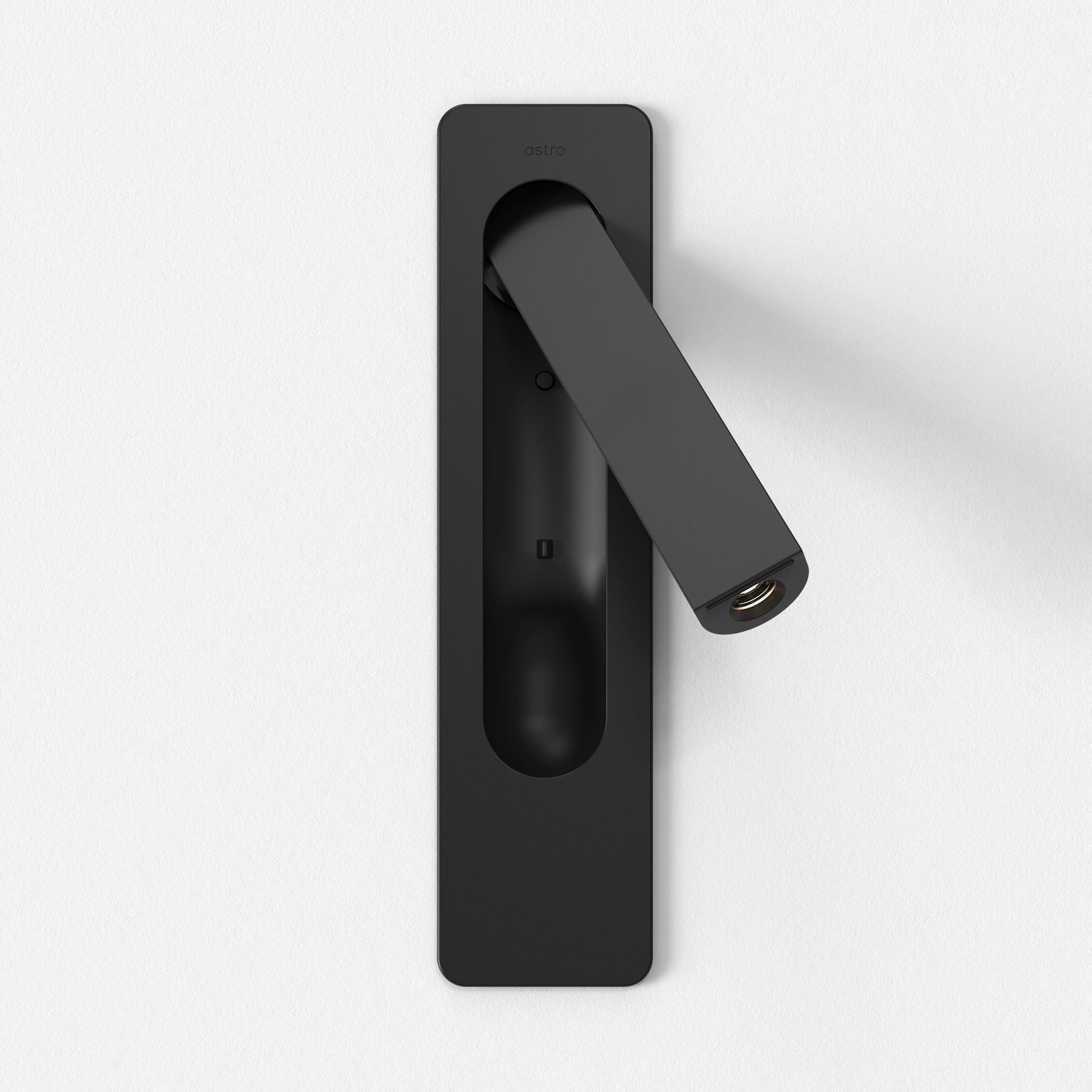 Front view of a reading wall lamp with integrated directional lighting and premium finish.