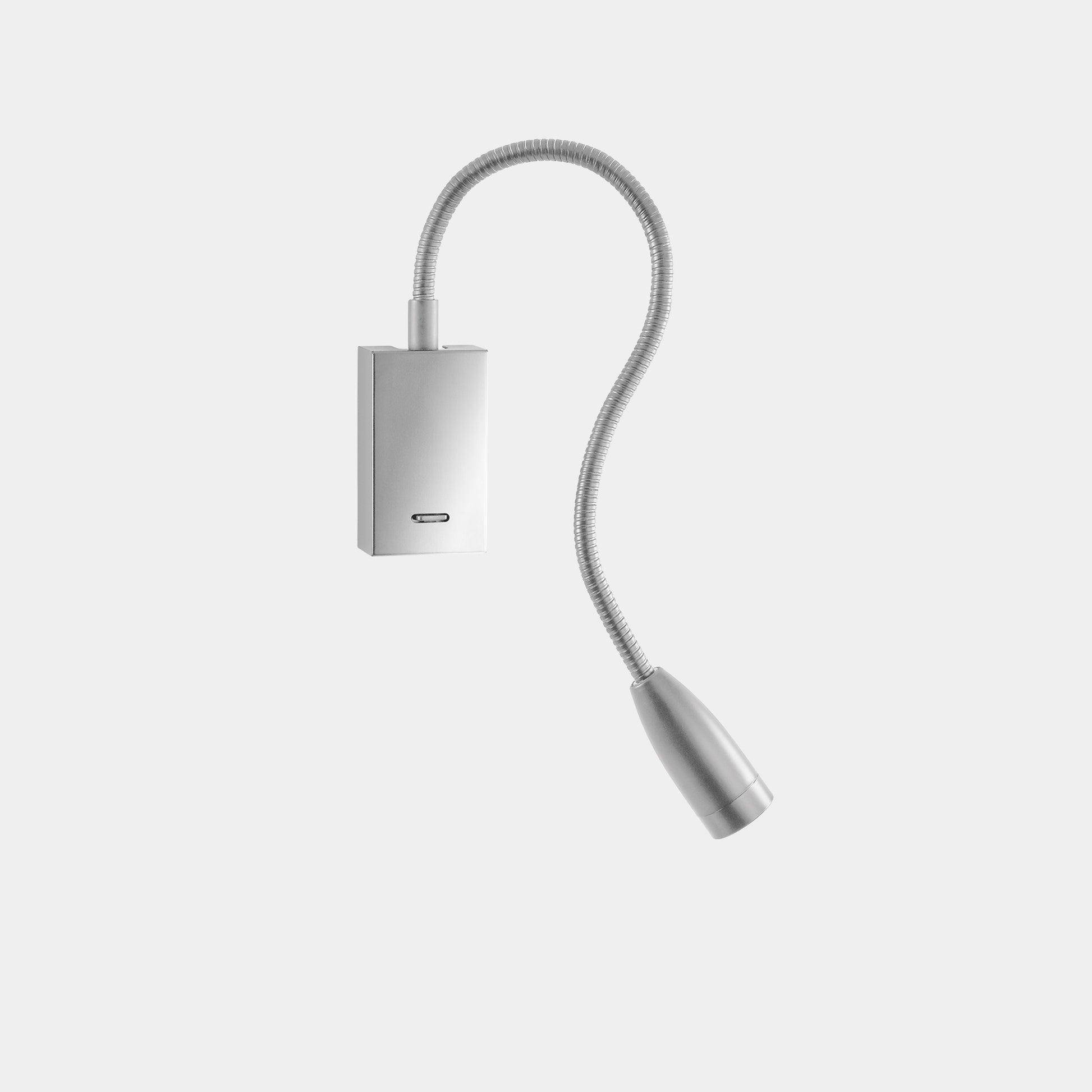 Front view of a reading wall lamp with integrated directional lighting and premium finish.