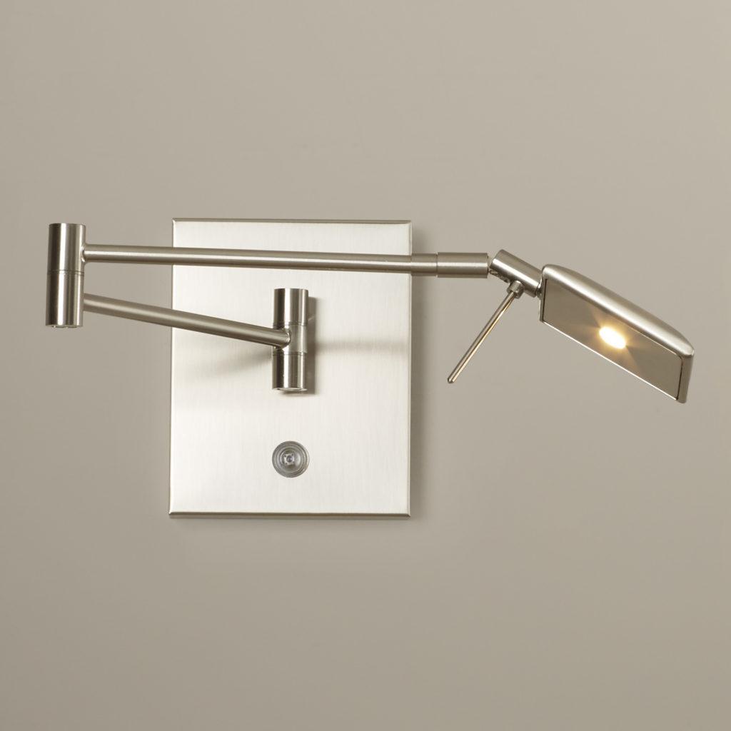 Front view of a reading wall lamp with integrated directional lighting and premium finish.