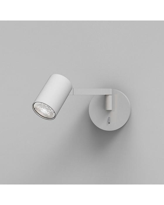 Front view of a reading wall lamp with integrated directional lighting and premium finish.