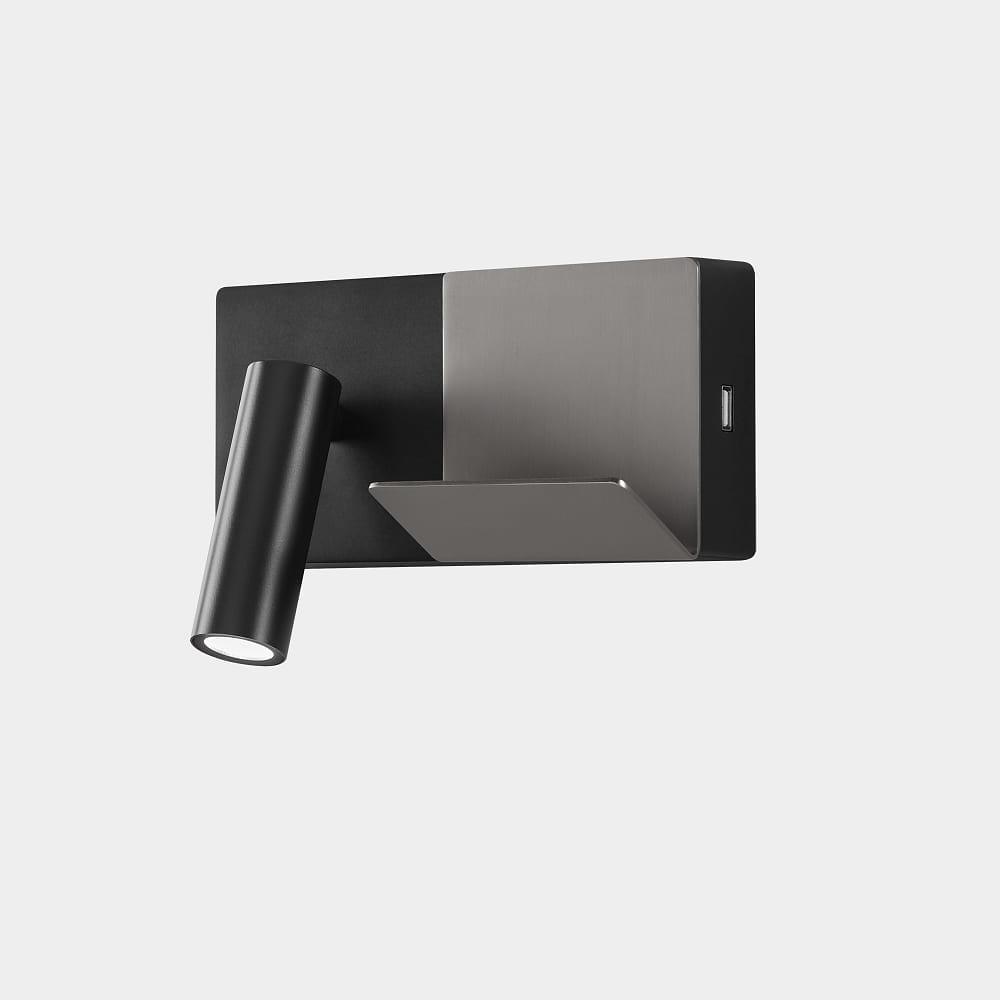 Front view of a reading wall lamp with integrated directional lighting and premium finish.