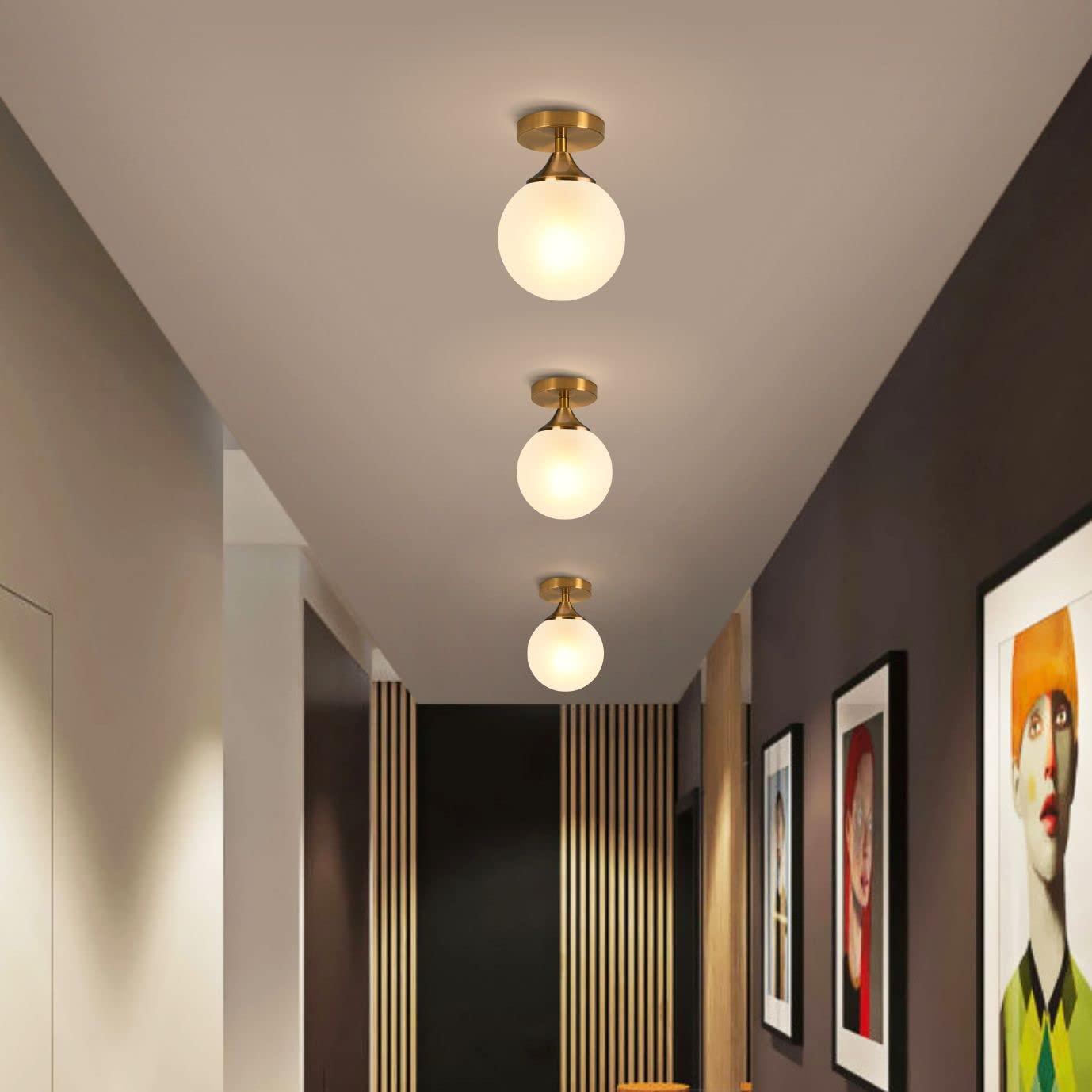 Globe ceiling lights integrated into a refined boutique hospitality interior