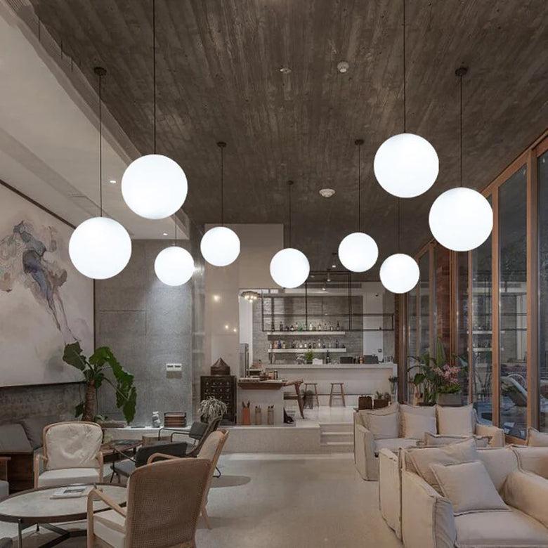 Globe ceiling lights integrated into a refined boutique hospitality interior