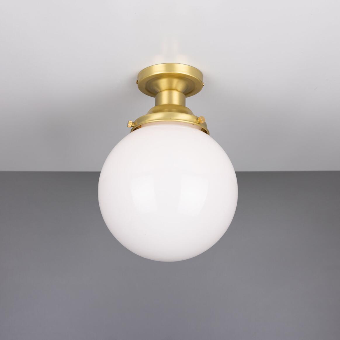 Front view of a white opal glass globe ceiling light