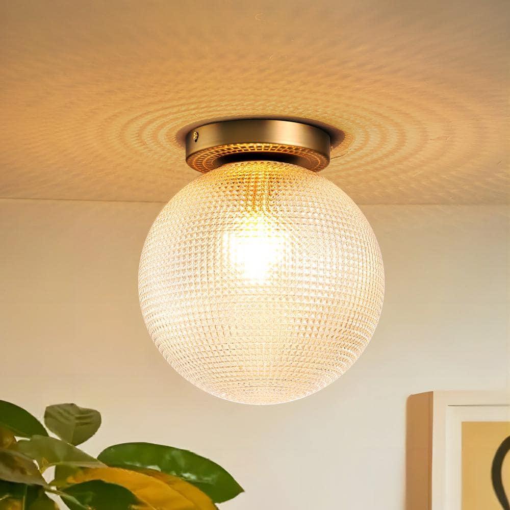 Globe ceiling lights integrated into a refined boutique hospitality interior