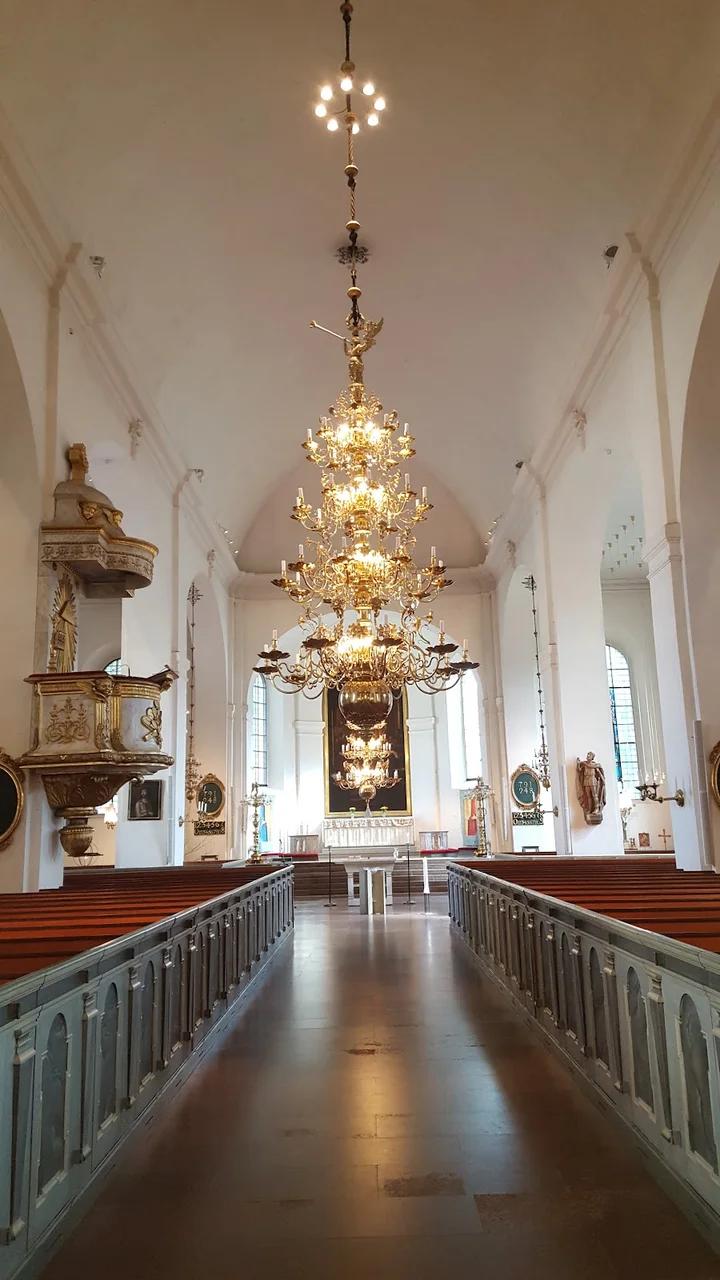 Classic chandelier installed in a prestigious historic hospitality interior.