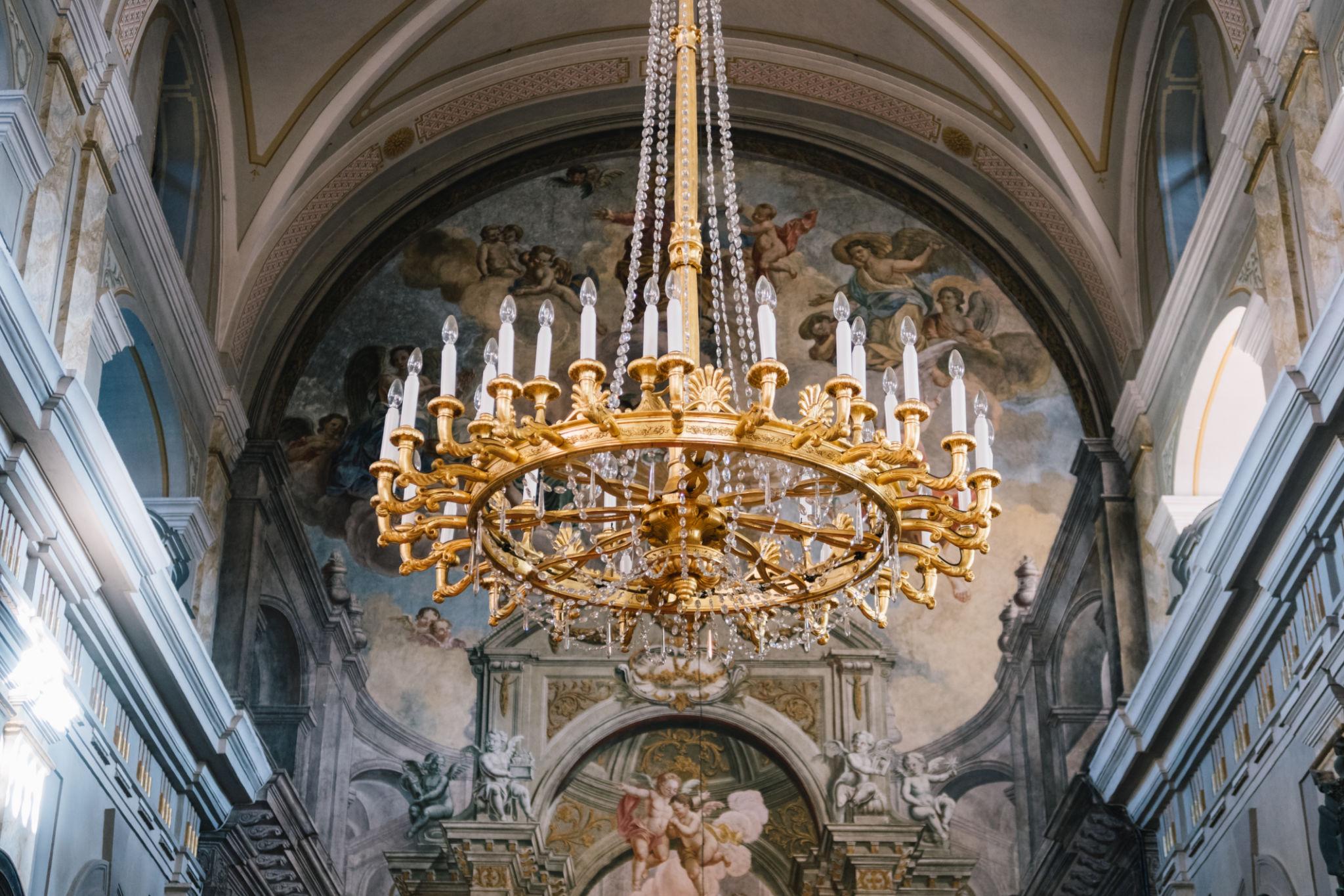 Classic chandelier installed in a prestigious historic hospitality interior.