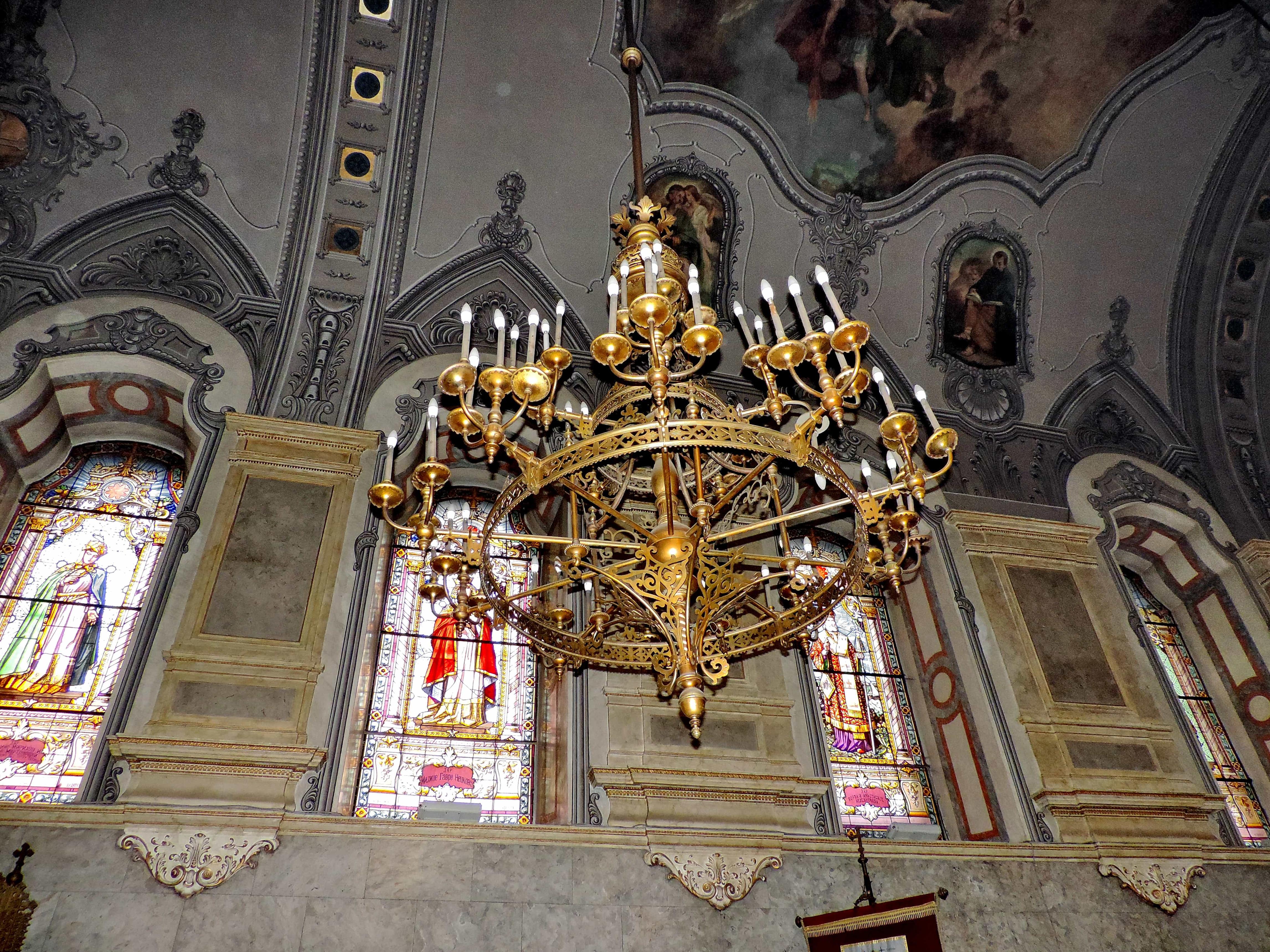 Classic chandelier installed in a prestigious historic hospitality interior.