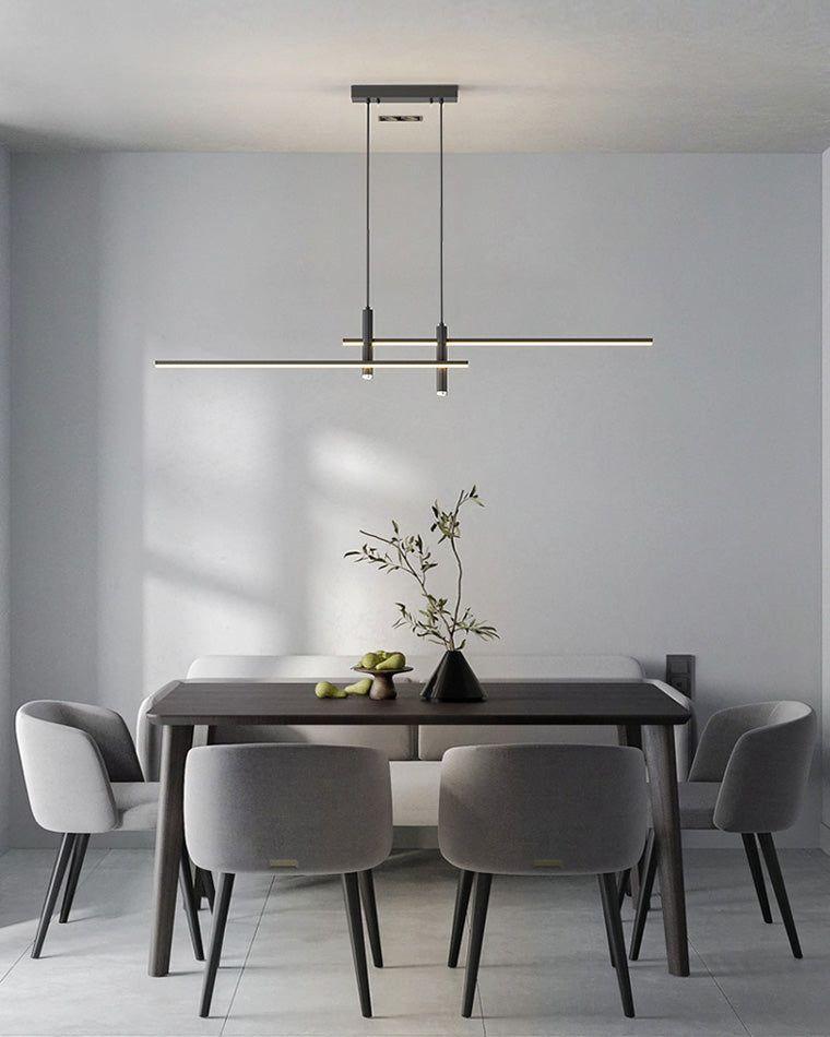 Minimal chandelier installed above a contemporary dining area in a premium architectural interior.