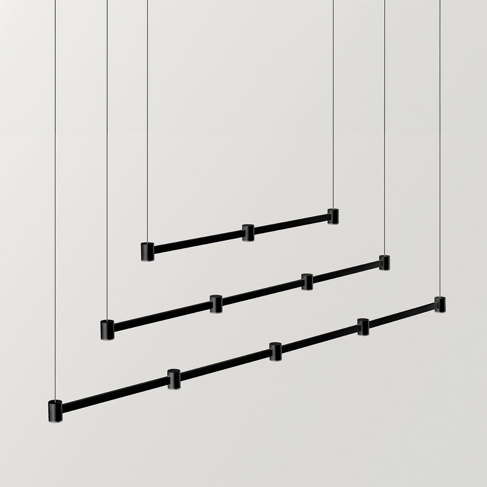 Minimal chandelier family featuring multiple sizes and linear configurations.