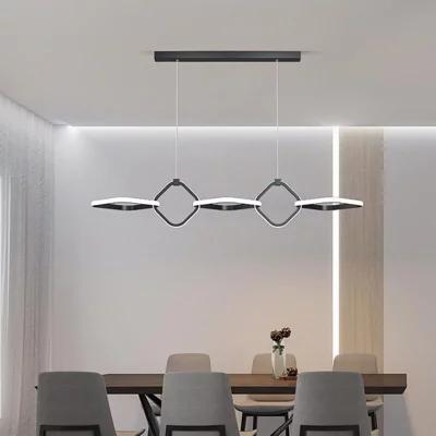 Minimal chandelier installed above a contemporary dining area in a premium architectural interior.