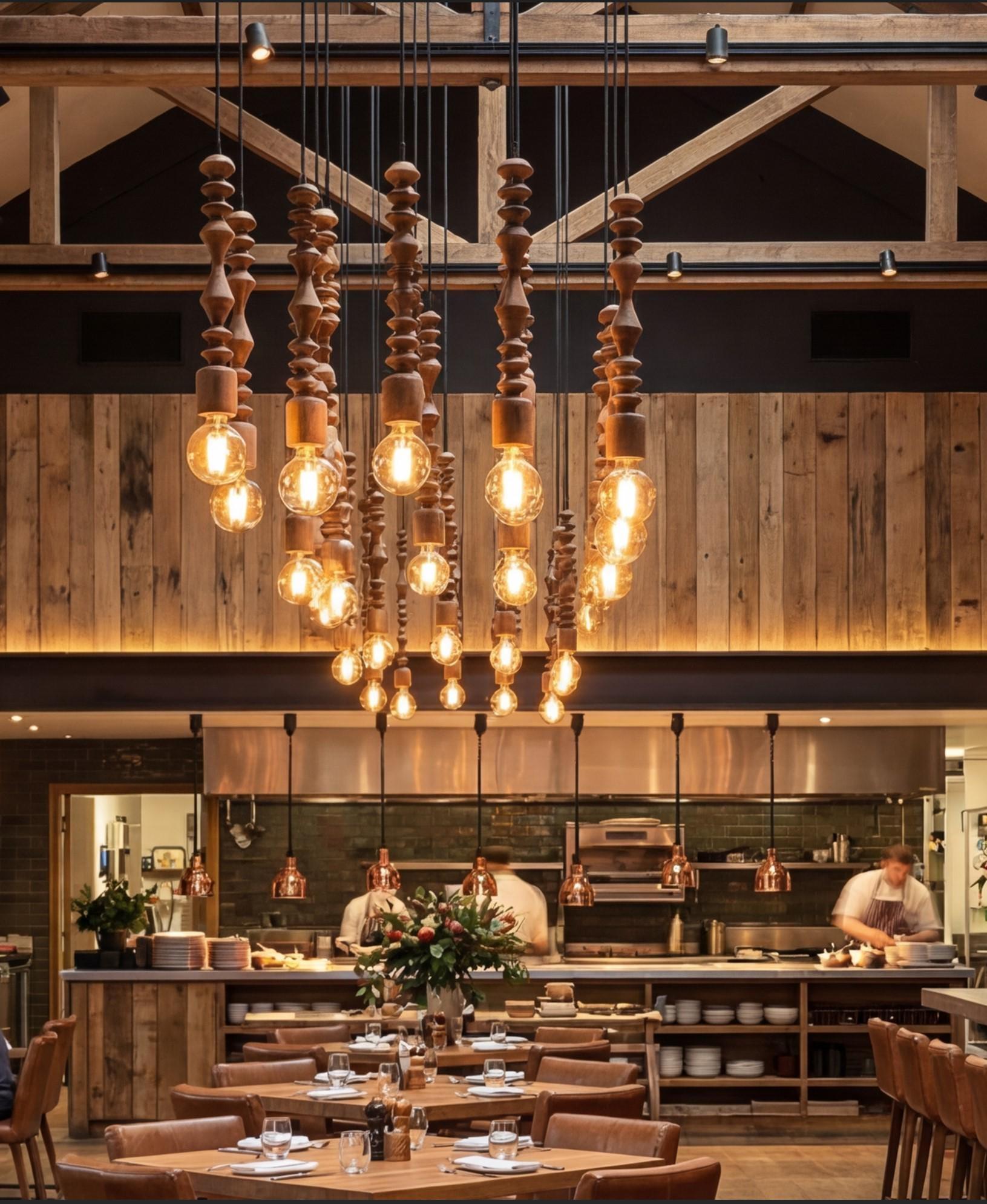 Wooden pendant lighting installed in a contemporary hospitality interior.