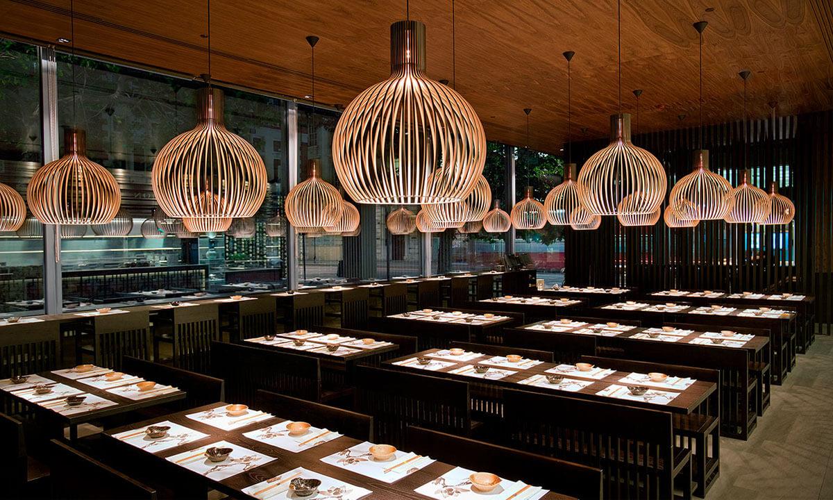 Wooden pendant lighting installed in a contemporary hospitality interior.