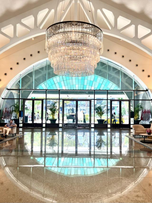 Crystal chandelier installed in a luxury hotel lobby with premium architectural design.