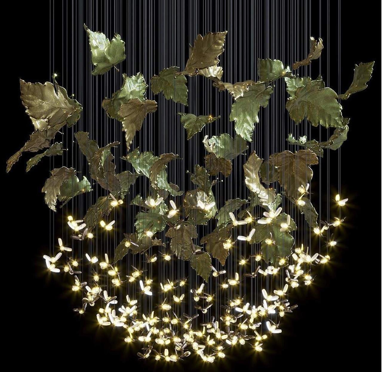 Front view of a sculptural organic chandelier with flowing contemporary forms.