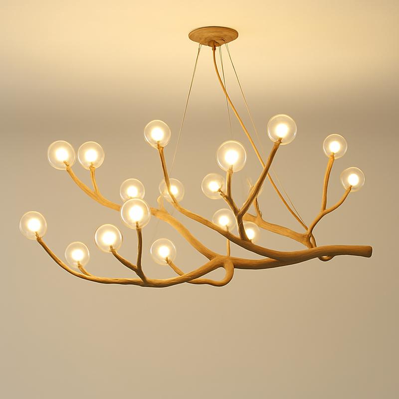 Front view of a sculptural organic chandelier with flowing contemporary forms.